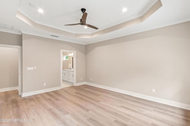 6334 Salado Rd, Saint Augustine, FL 32080 - unfurnished bedroom with a raised ceiling, ornamental molding, light wood-type flooring, recessed lighting, and ensuite bathroom