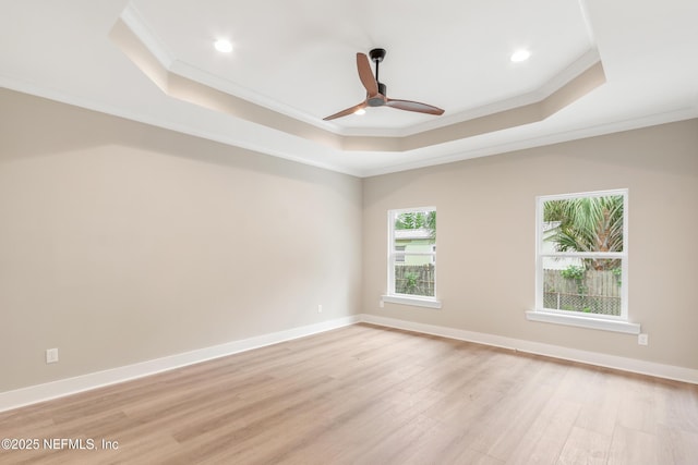 6334 Salado Rd, Saint Augustine, FL 32080 - empty room with a raised ceiling, crown molding, light wood finished floors, ceiling fan, and recessed lighting