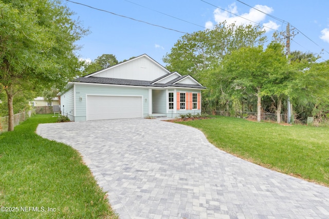 6334 Salado Rd, Saint Augustine, FL 32080 - ranch-style house featuring decorative driveway and a garage