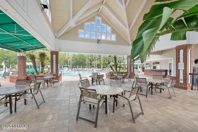 1911 Salt Creek Dr, Fleming Island, FL 32003 - view of patio / terrace featuring a community pool and outdoor dining area