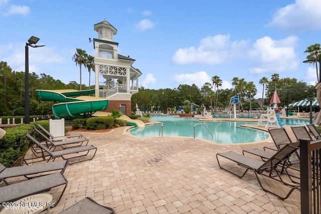 1911 Salt Creek Dr, Fleming Island, FL 32003 - community pool with a water slide and a patio