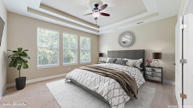 1911 Salt Creek Dr, Fleming Island, FL 32003 - bedroom with a tray ceiling and light colored carpet
