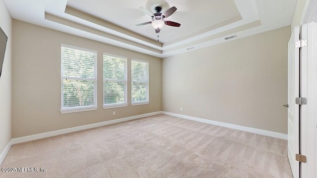 1911 Salt Creek Dr, Fleming Island, FL 32003 - unfurnished room featuring a raised ceiling, light colored carpet, and ceiling fan