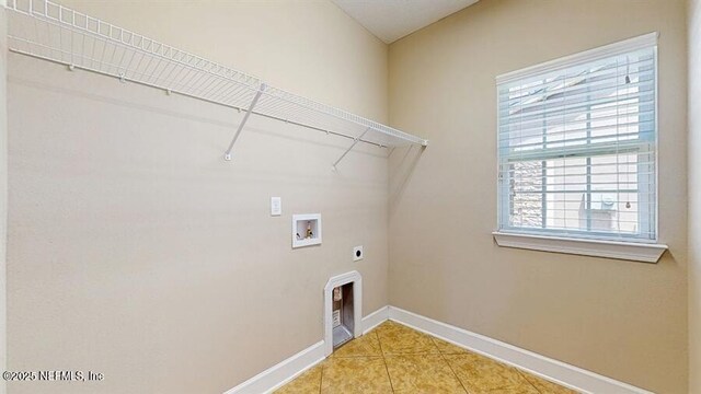 1911 Salt Creek Dr, Fleming Island, FL 32003 - laundry room with electric dryer hookup, hookup for a washing machine, and light tile patterned floors