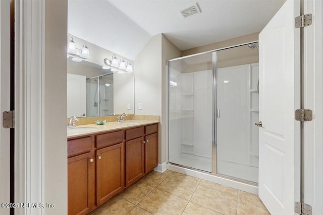 1911 Salt Creek Dr, Fleming Island, FL 32003 - bathroom with tile patterned floors, double vanity, and a shower stall