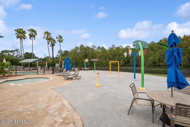 1911 Salt Creek Dr, Fleming Island, FL 32003 - surrounding community with a pool, a patio, and a hot tub