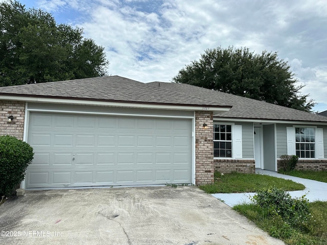 3769 August Crossing Ct, Jacksonville, FL 32210 - ranch-style home featuring brick siding, concrete driveway, a garage, and roof with shingles