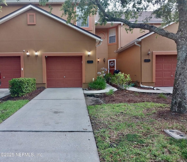 6827 Misty View Dr, Jacksonville, FL 32210 - view of front of property with stucco siding and driveway