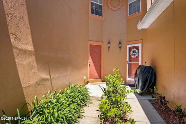 6827 Misty View Dr, Jacksonville, FL 32210 - view of exterior entry with stucco siding