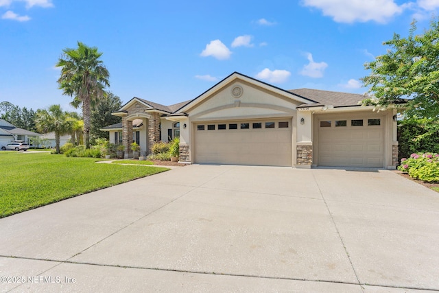 33114 Prairie Parke Pl, Fernandina Beach, FL 32034 - view of front of house featuring stucco siding, an attached garage, stone siding, a front lawn, and concrete driveway