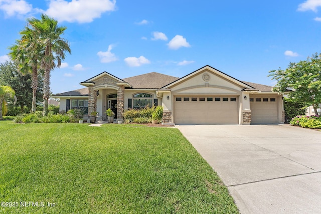 33114 Prairie Parke Pl, Fernandina Beach, FL 32034 - view of front facade with stucco siding, stone siding, a garage, and a front yard