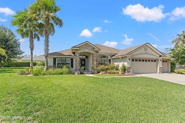 33114 Prairie Parke Pl, Fernandina Beach, FL 32034 - view of front of property featuring stone siding, an attached garage, a front yard, stucco siding, and driveway