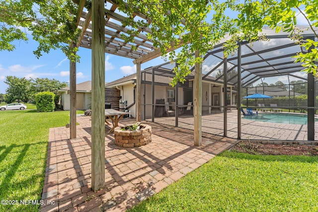33114 Prairie Parke Pl, Fernandina Beach, FL 32034 - view of patio / terrace with a fire pit, an outdoor pool, a pergola, glass enclosure, and an outdoor structure