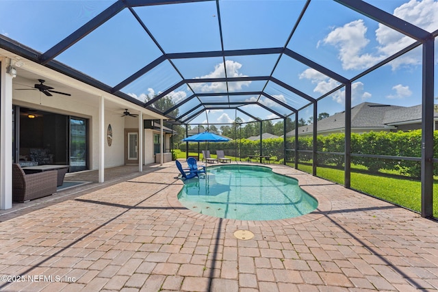 33114 Prairie Parke Pl, Fernandina Beach, FL 32034 - swimming pool featuring a patio area, a ceiling fan, and glass enclosure