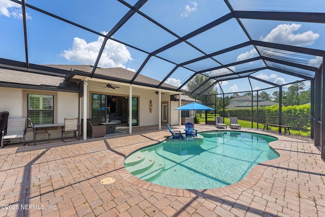 33114 Prairie Parke Pl, Fernandina Beach, FL 32034 - swimming pool featuring a patio, ceiling fan, and glass enclosure