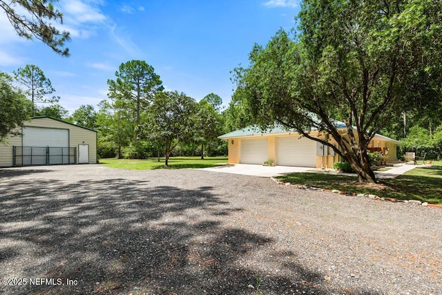 6672 Crooked Creek Ln, Saint Augustine, FL 32095 - view of side of property featuring a garage and an outbuilding