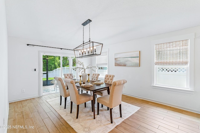 141 Balmoral Castle Dr, Saint Johns, FL 32259 - dining space with light wood-style floors and a chandelier