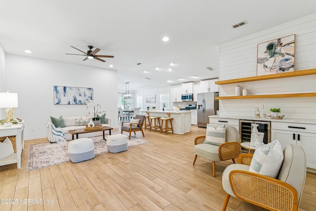 141 Balmoral Castle Dr, Saint Johns, FL 32259 - living area featuring ceiling fan, recessed lighting, light wood-style floors, wine cooler, and a bar