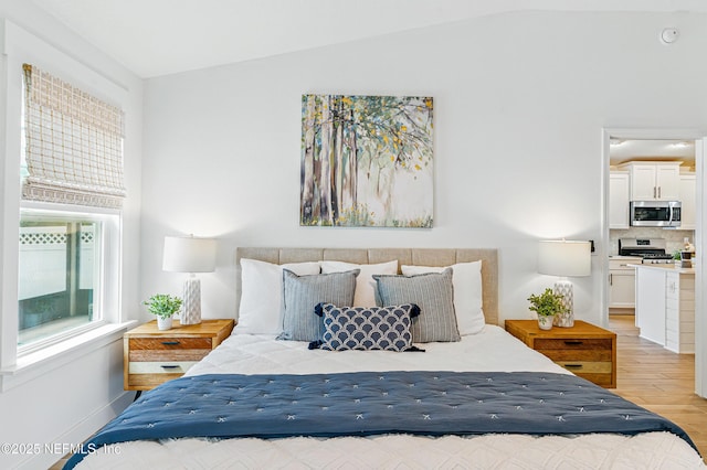 141 Balmoral Castle Dr, Saint Johns, FL 32259 - bedroom with light wood-style flooring and vaulted ceiling