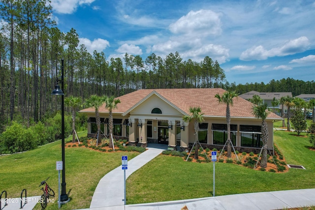 141 Balmoral Castle Dr, Saint Johns, FL 32259 - view of front of house featuring a front yard, french doors, and stucco siding