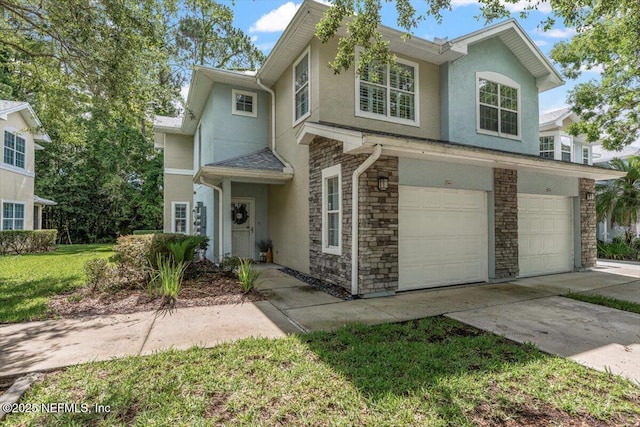 215 Bayberry Cir Unit 601, Saint Augustine, FL 32086 - view of front of house with stucco siding, an attached garage, concrete driveway, and stone siding
