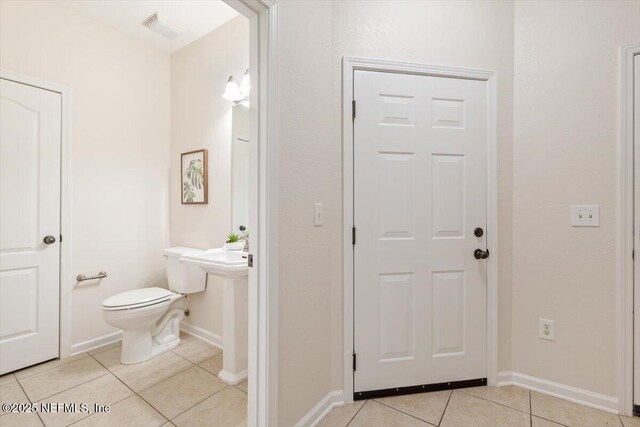215 Bayberry Cir Unit 601, Saint Augustine, FL 32086 - half bathroom featuring tile patterned flooring and toilet