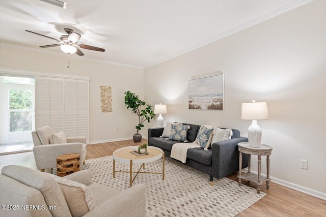 215 Bayberry Cir Unit 601, Saint Augustine, FL 32086 - living room featuring light wood finished floors, ceiling fan, and crown molding