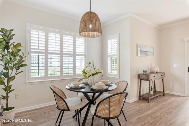 215 Bayberry Cir Unit 601, Saint Augustine, FL 32086 - dining space featuring wood finished floors, healthy amount of natural light, and crown molding