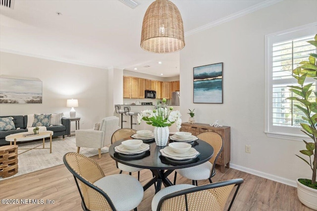 215 Bayberry Cir Unit 601, Saint Augustine, FL 32086 - dining area featuring light wood-style flooring and ornamental molding