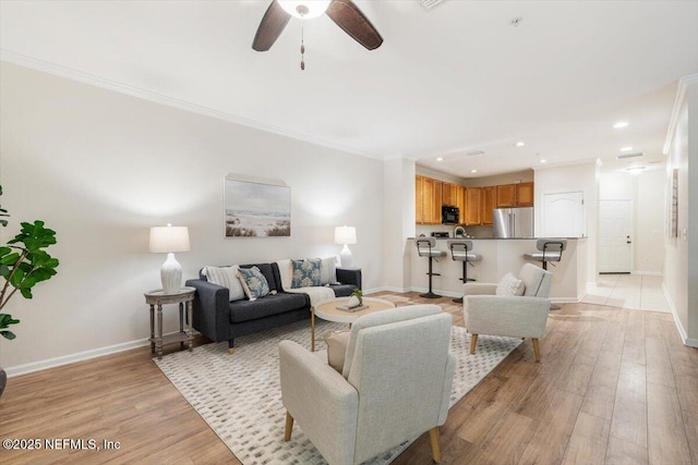 215 Bayberry Cir Unit 601, Saint Augustine, FL 32086 - living area featuring a ceiling fan, recessed lighting, light wood-type flooring, and crown molding