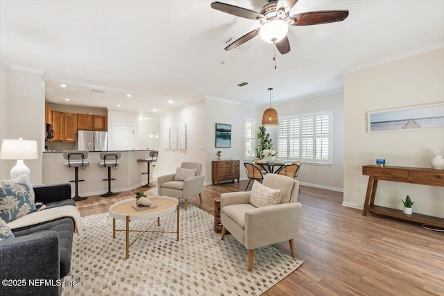 215 Bayberry Cir Unit 601, Saint Augustine, FL 32086 - living room with ornamental molding, light wood-type flooring, recessed lighting, and ceiling fan