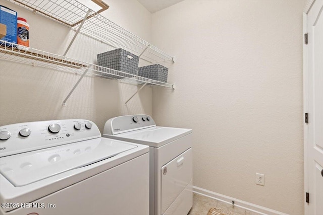 215 Bayberry Cir Unit 601, Saint Augustine, FL 32086 - laundry room with independent washer and dryer and light tile patterned flooring