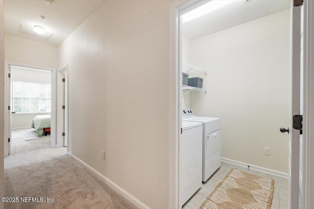 215 Bayberry Cir Unit 601, Saint Augustine, FL 32086 - washroom featuring washing machine and clothes dryer and light carpet