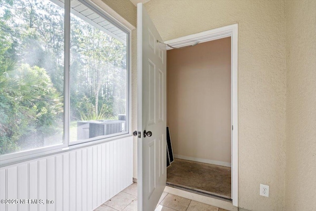 215 Bayberry Cir Unit 601, Saint Augustine, FL 32086 - interior space with light tile patterned floors and a textured wall