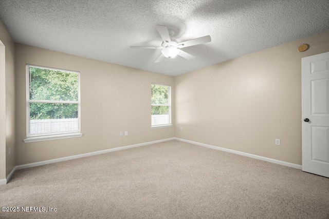 268 Southlake Dr, Saint Augustine, FL 32092 - spare room with a ceiling fan, light colored carpet, a textured ceiling, and plenty of natural light