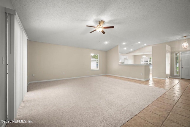 268 Southlake Dr, Saint Augustine, FL 32092 - unfurnished living room with a ceiling fan, lofted ceiling, a textured ceiling, recessed lighting, and tile patterned flooring