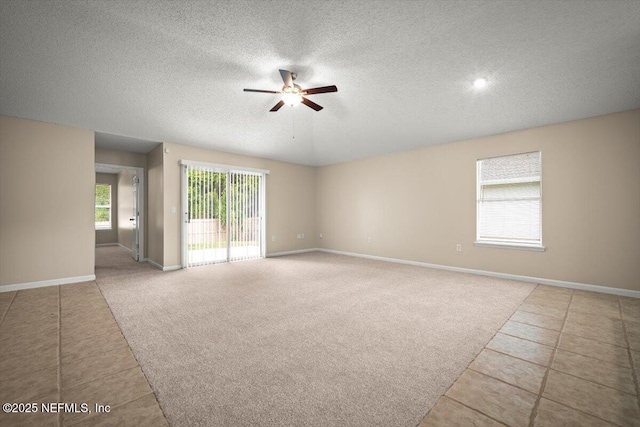 268 Southlake Dr, Saint Augustine, FL 32092 - tiled spare room with a ceiling fan, a textured ceiling, and carpet flooring