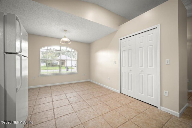 268 Southlake Dr, Saint Augustine, FL 32092 - unfurnished dining area featuring tile patterned floors and a textured ceiling