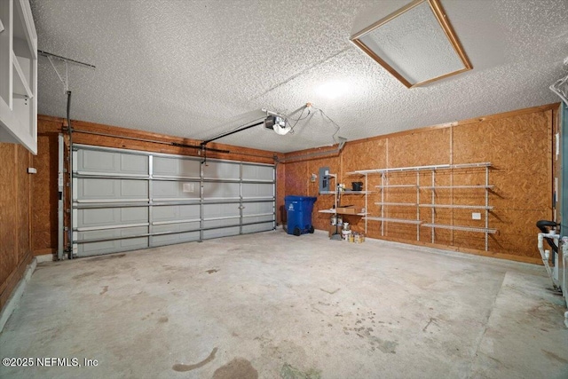 268 Southlake Dr, Saint Augustine, FL 32092 - garage featuring a garage door opener and wooden walls