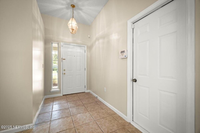 268 Southlake Dr, Saint Augustine, FL 32092 - foyer with baseboards and light tile patterned floors