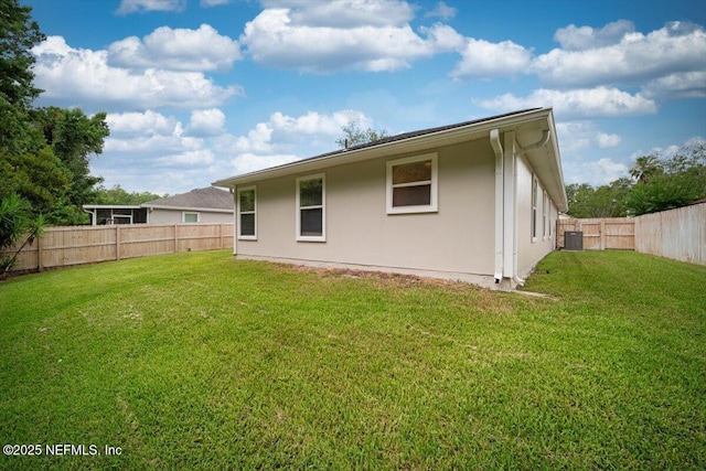 268 Southlake Dr, Saint Augustine, FL 32092 - rear view of house with a fenced backyard and stucco siding