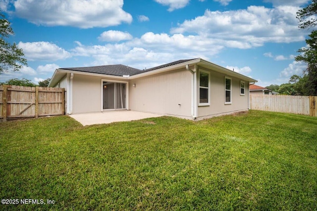268 Southlake Dr, Saint Augustine, FL 32092 - back of property with a patio area and stucco siding