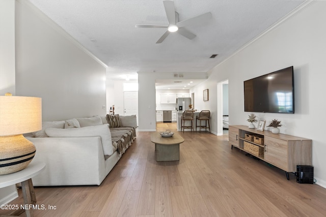 1578 Linkside Dr, Atlantic Beach, FL 32233 - living area featuring a ceiling fan, crown molding, and light wood-style flooring