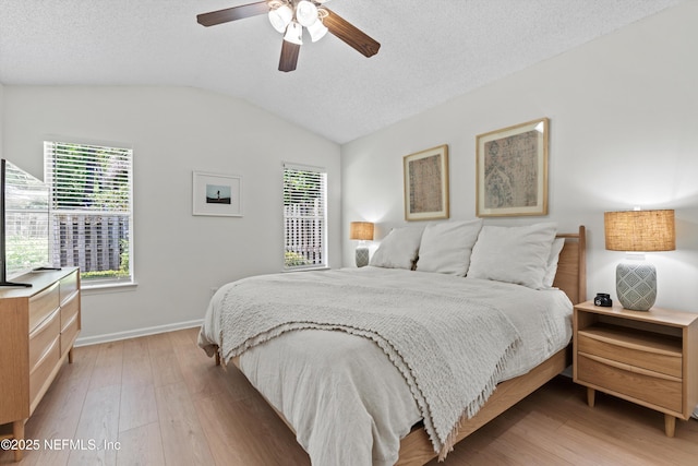 1578 Linkside Dr, Atlantic Beach, FL 32233 - bedroom with vaulted ceiling, light wood-type flooring, ceiling fan, and a textured ceiling