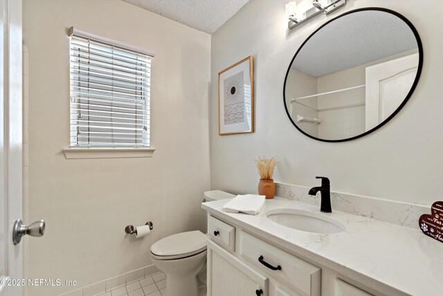 1578 Linkside Dr, Atlantic Beach, FL 32233 - full bathroom featuring a textured ceiling, vanity, tile patterned flooring, and a shower