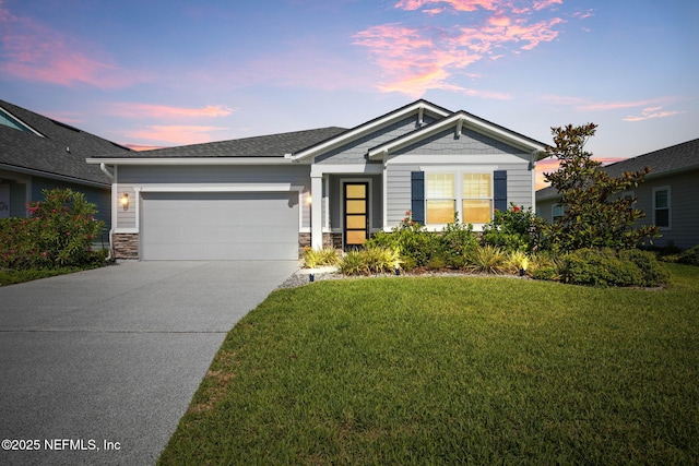 7 Los Lagos Blvd, Palm Coast, FL 32137 - view of front facade with a garage, driveway, a front lawn, and stone siding