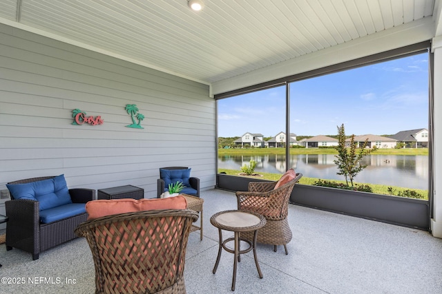 7 Los Lagos Blvd, Palm Coast, FL 32137 - sunroom featuring a water view, a residential view, and an outdoor hangout area