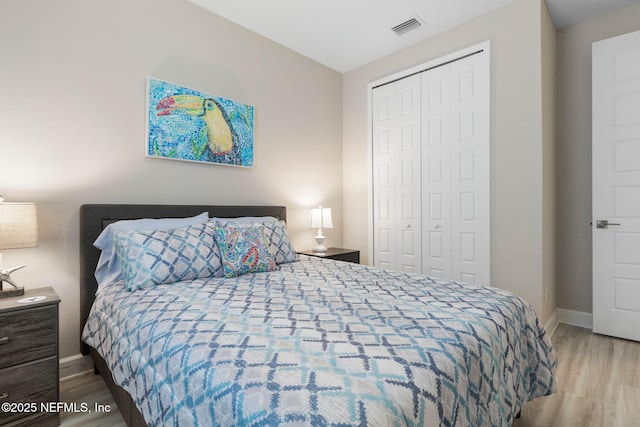 7 Los Lagos Blvd, Palm Coast, FL 32137 - bedroom featuring wood finished floors and a closet