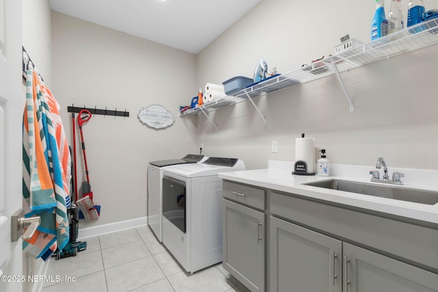 7 Los Lagos Blvd, Palm Coast, FL 32137 - laundry area with washer and clothes dryer, cabinet space, and light tile patterned floors