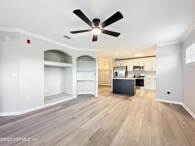 3591 Kernan Blvd S Unit 127, Jacksonville, FL 32224 - unfurnished living room featuring ceiling fan, light wood-type flooring, built in features, and ornamental molding